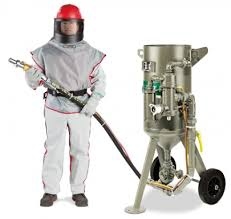 Clemco abrasive blasting pot and operator