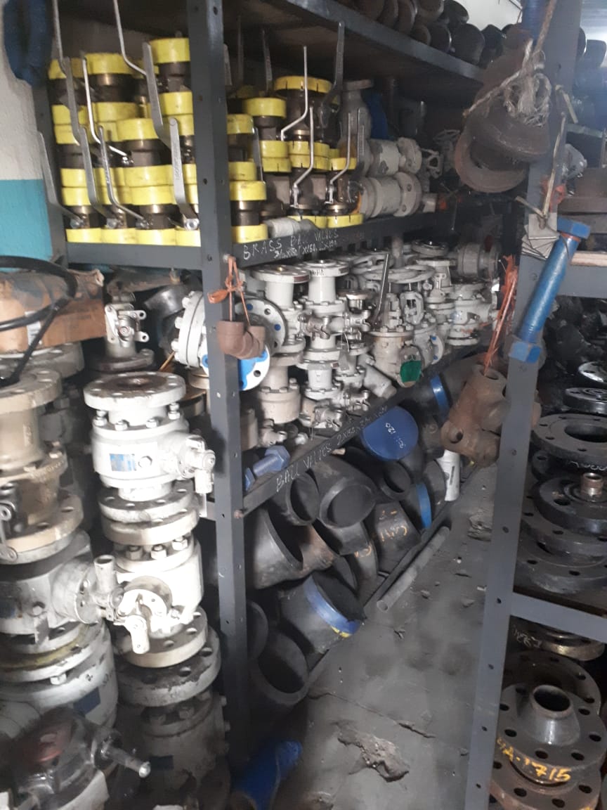 Warehouse inventory of industrial ball valves, flanged pipeline fittings and cable trays