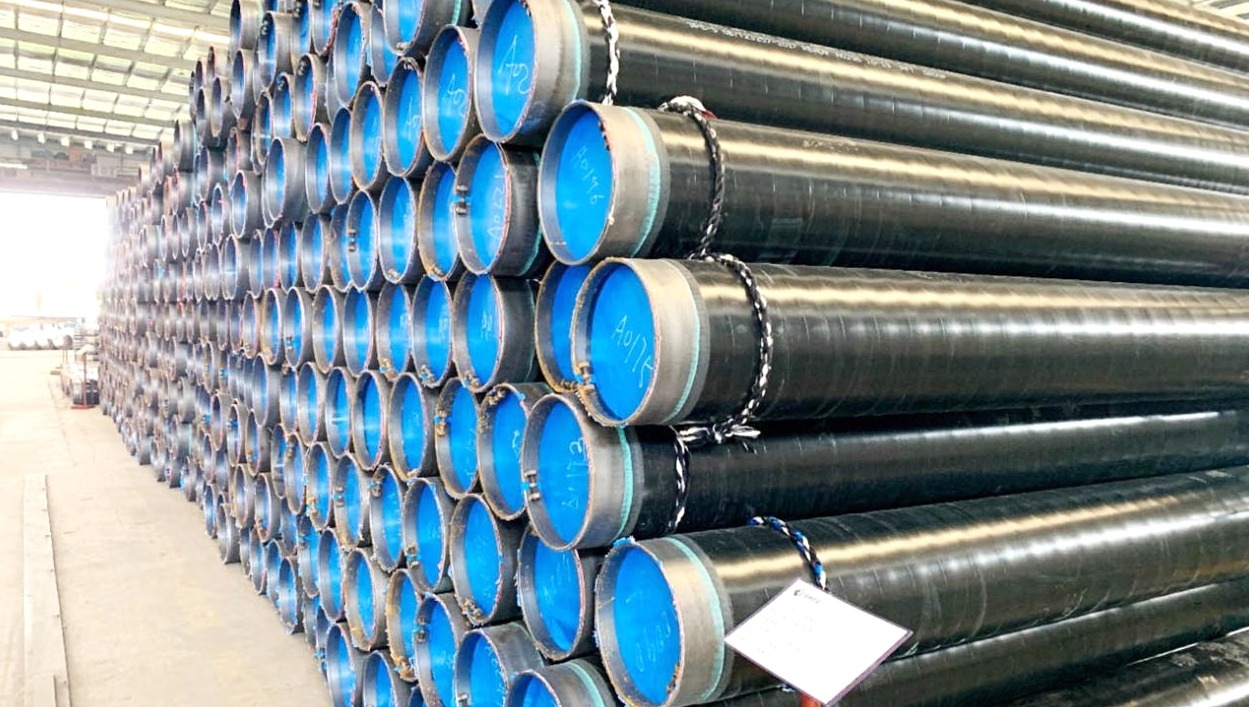 Stacked industrial steel pipes in warehouse